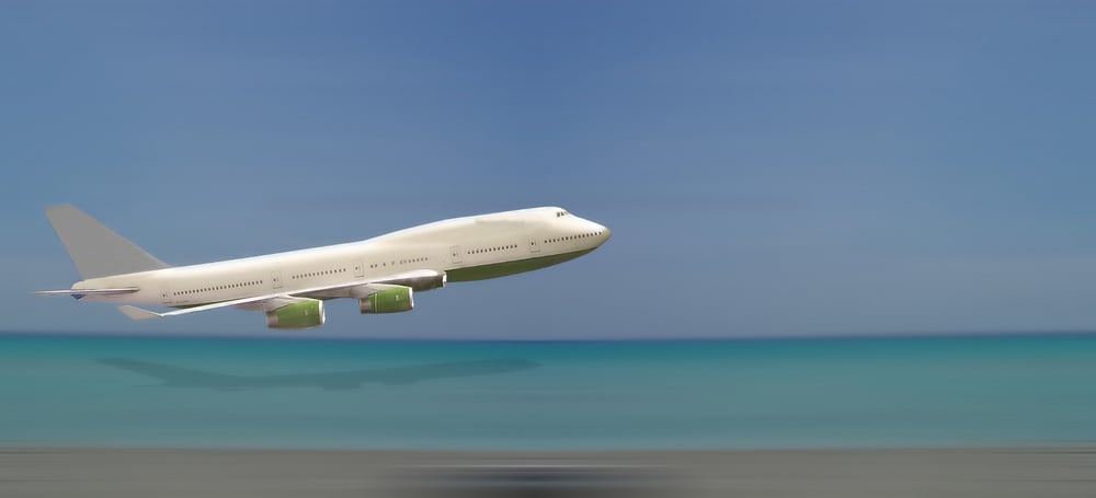 Airplane over beach